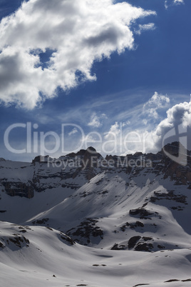 snow mountains and blue sky with clouds