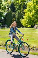 Girl enjoying summer break riding bicycle