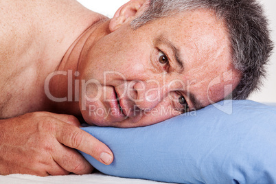 Man lying in bed and can not sleep