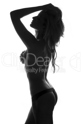 backlit portrait of a sexy topless woman