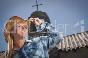 Beautiful Cowgirl Portrait with Old Church Behind