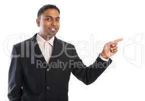 Indian business man pointing at blank space.