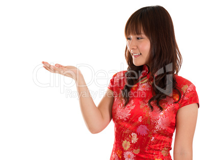 Chinese Cheongsam woman showing something