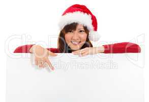 Christmas girl showing blank billboard banner