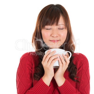 Asian girl enjoying coffee