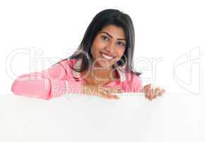 Indian woman holding blank billboard.