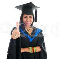 Indian graduate student giving thumb up hand sign