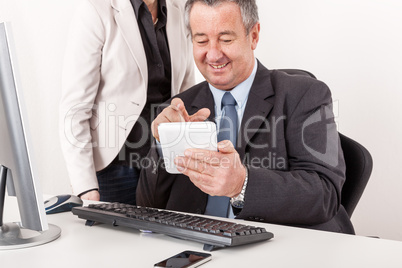 Businessman and businesswoman with tablet PC