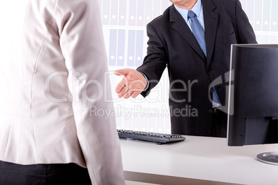 Businessman and Businesswoman in office