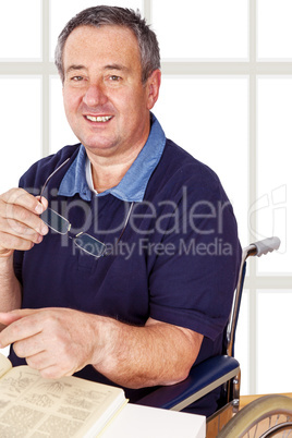 Man sitting in a wheelchair at the table