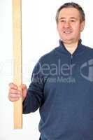 Man with wooden slat