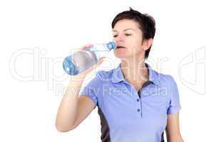 Sporty woman drinking from water bottle