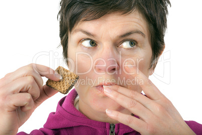 Woman eating biscuit