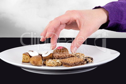 Hand reaching for cake plate