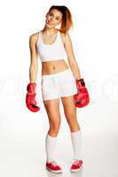 smiling beautiful woman wearing boxing gloves