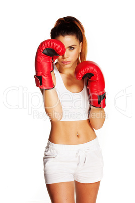 pretty woman with boxing gloves and a fighter look