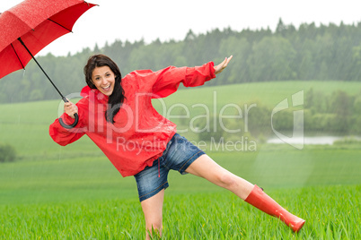 Playful happy girl in the rain