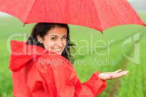Lively teenager girl in the rain