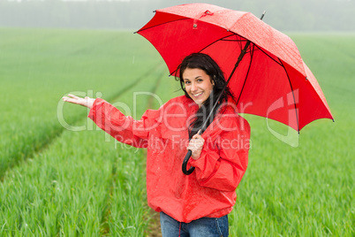 Elated smiling girl during rainy weather