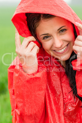 Portrait of cheerful teenager in the rain