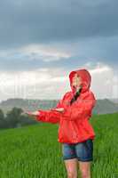 Carefree young girl enjoying rainy weather