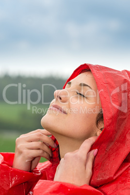 Portrait of young girl feeling the rain