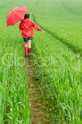 Lonely girl walking in the rain