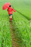 Lonely girl walking in the rain