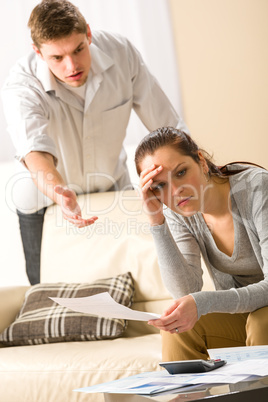 Worried arguing couple has financial crisis