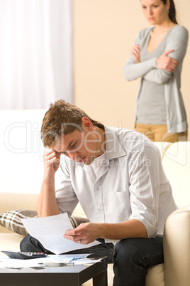 Stressed man and woman arguing about budget