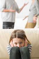 Little girl is troubled because parents arguing