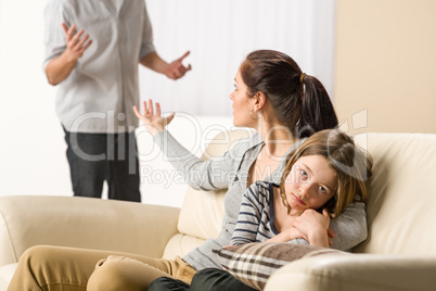 Arguing parents with upset little girl