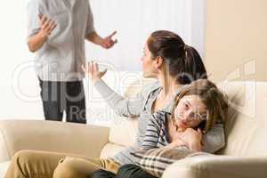 Arguing parents with upset little girl