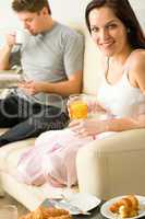 Resting couple having breakfast together in hotel