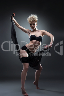 Sexy woman dancing with black fabric