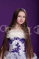 Portrait of beautiful little girl with long hair