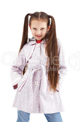 Beautiful little girl posing in fashionable coat