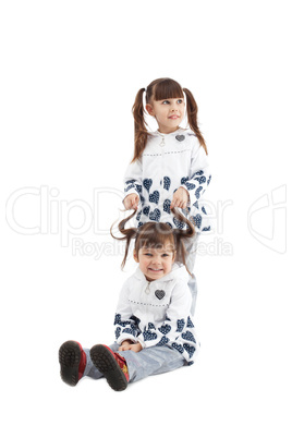 Smiling little girls in fashionable jackets