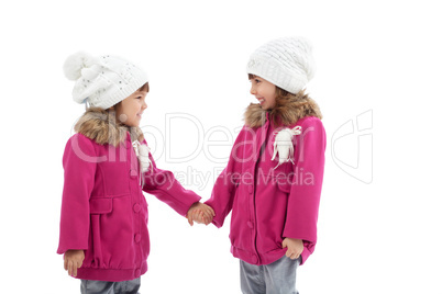 Pretty little kids smiling at each other