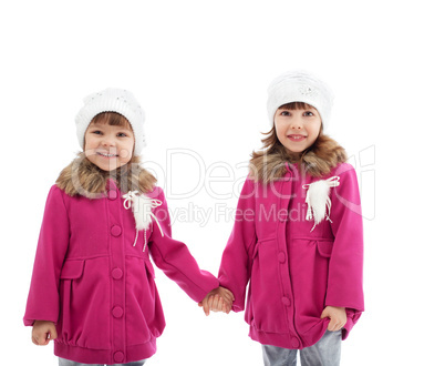 Adorable little girls posing looking at camera