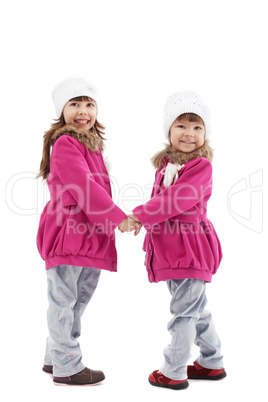 Cheerful little kids posing in studio