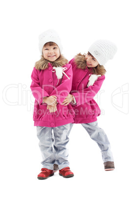 Playful little girls posing in studio