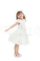 Smiling cute girl posing in white dress
