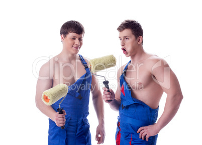 Image of cheerful painters posing in studio