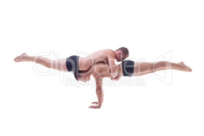 Muscled acrobats keep balance