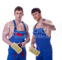 Two young painters posing in workwear