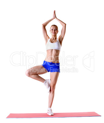 Cheerful slender girl posing in sports wear