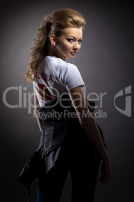 Playful young girl posing in studio