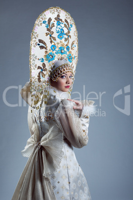 Portrait of young woman in traditional costume