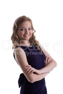 Smiling young woman posing in blue dress